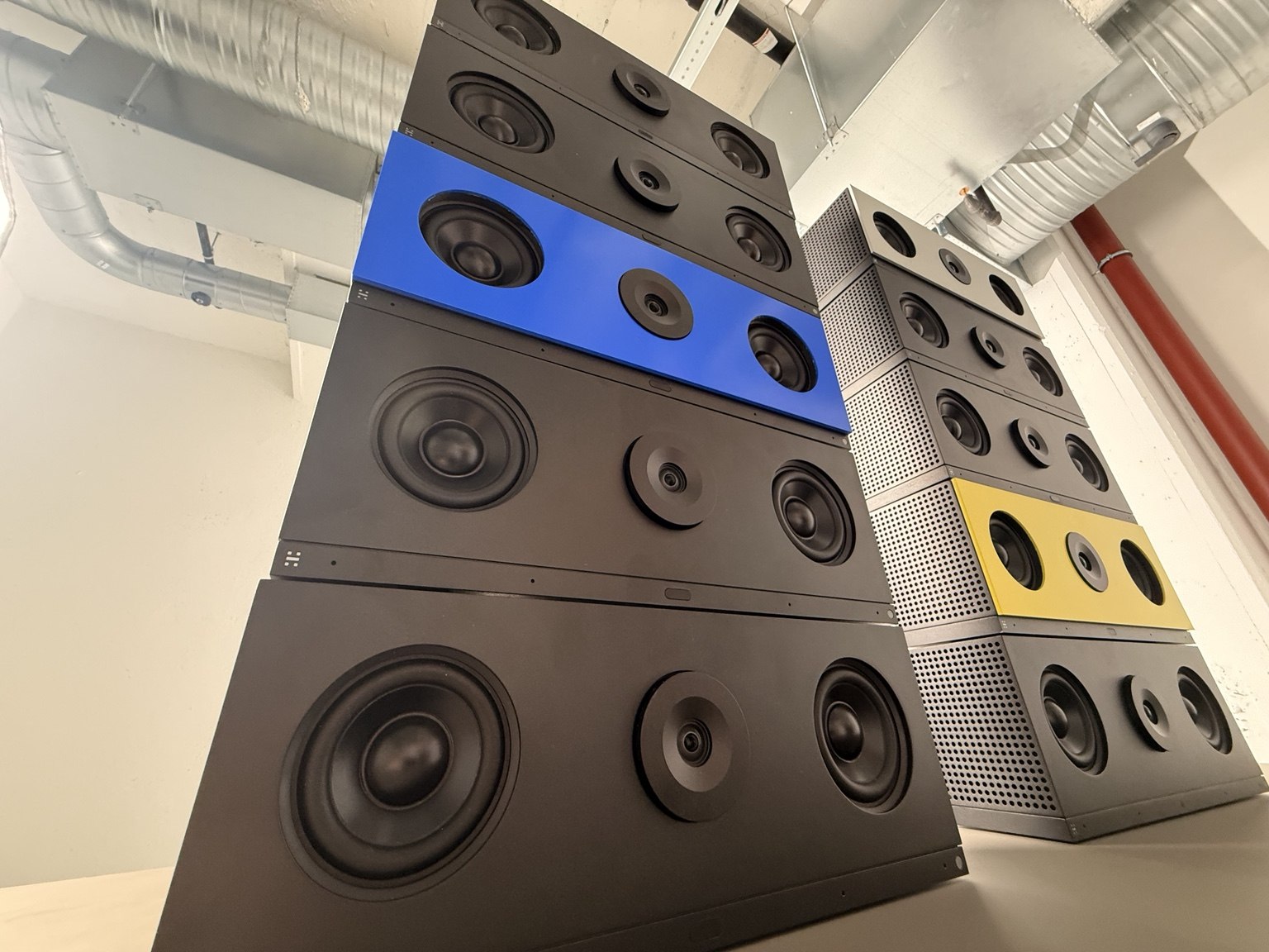 Tall stacks of colourful loudspeakers